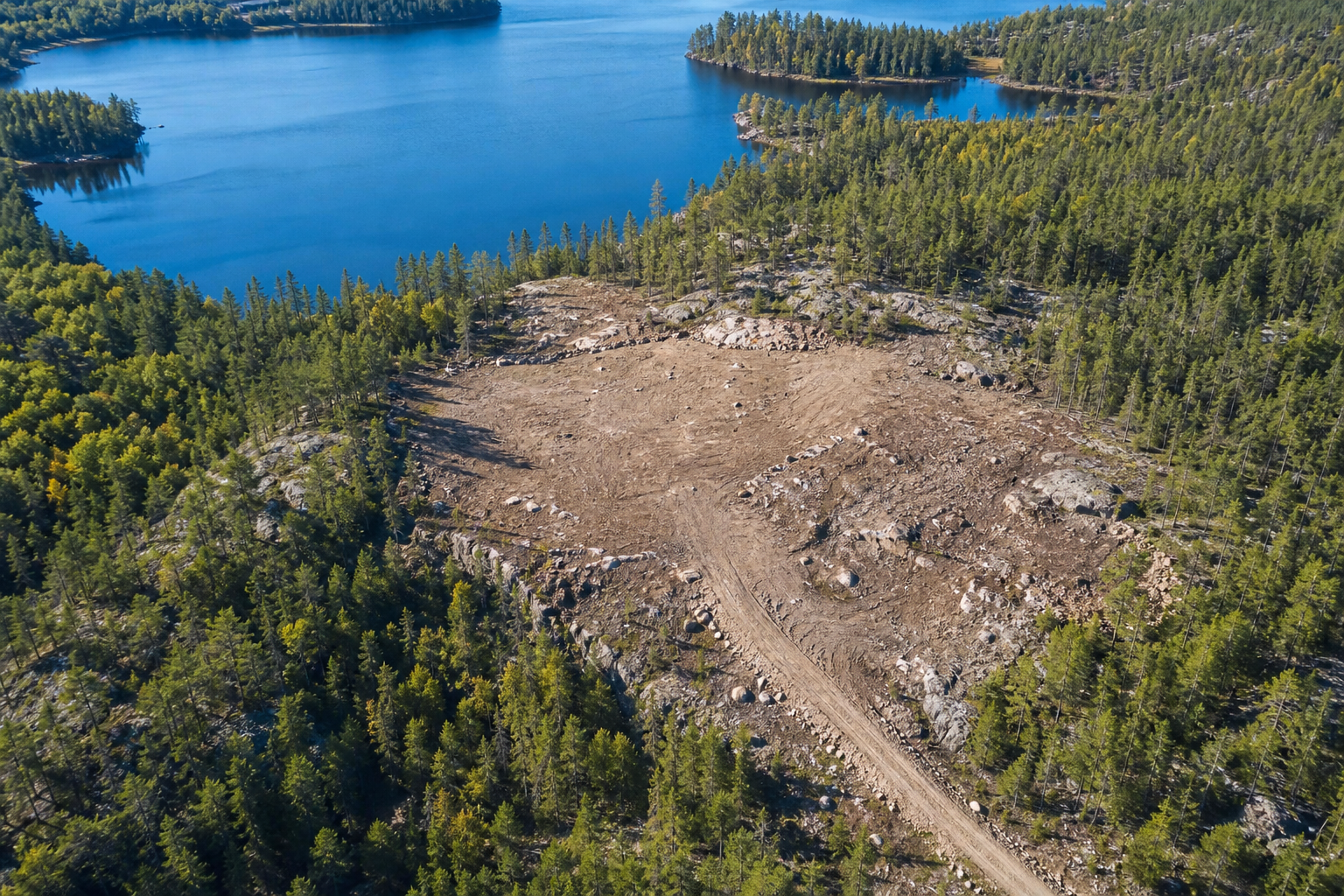 Aerial view of a remote Northern Ontario clearing near water